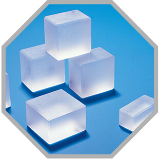 Crystals in a grey comb with blue blackground